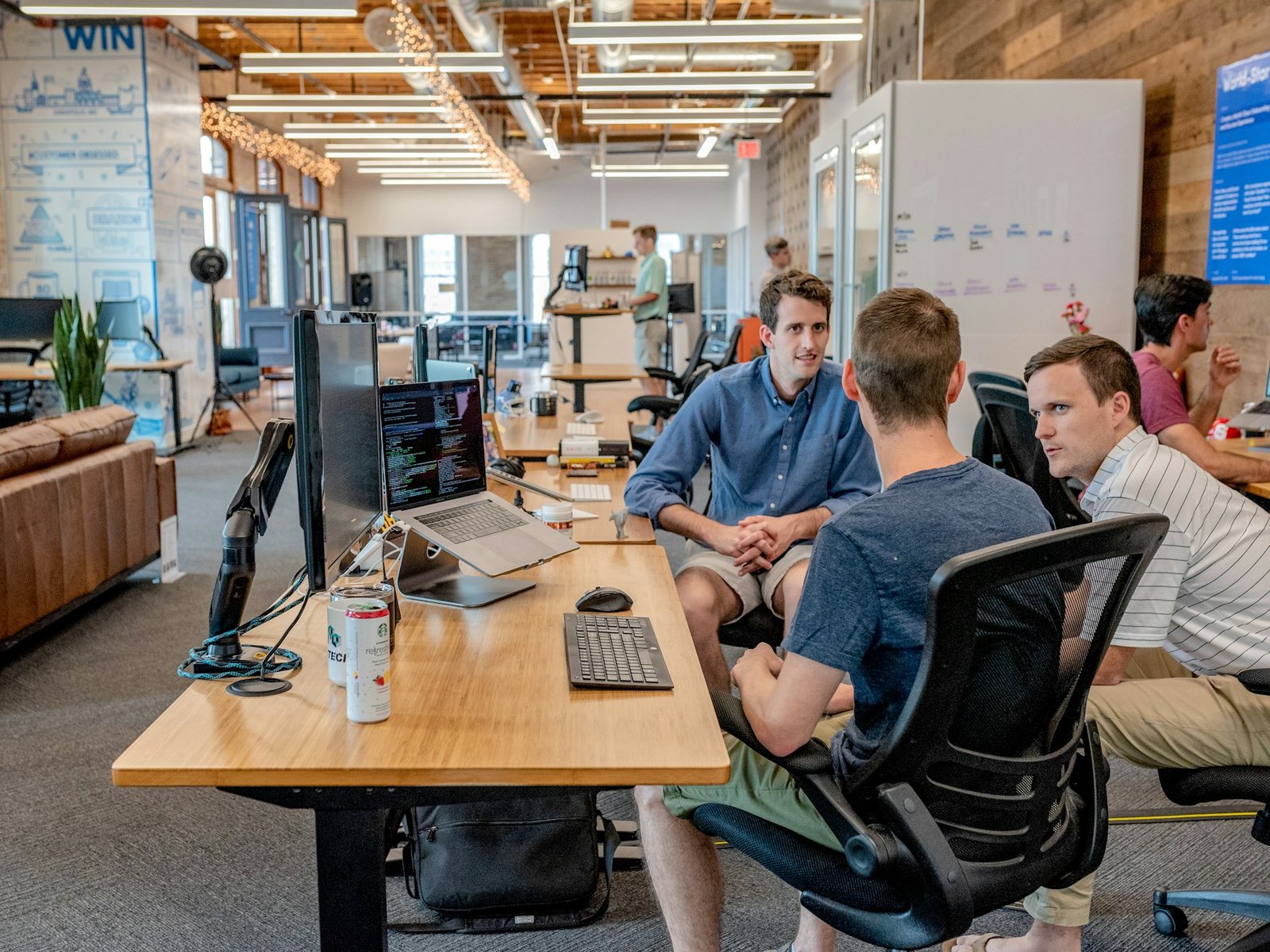 Product and engineering team collaborating around a shared workspace